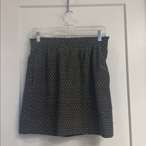 Black, paper bag skirt with delicate white detail